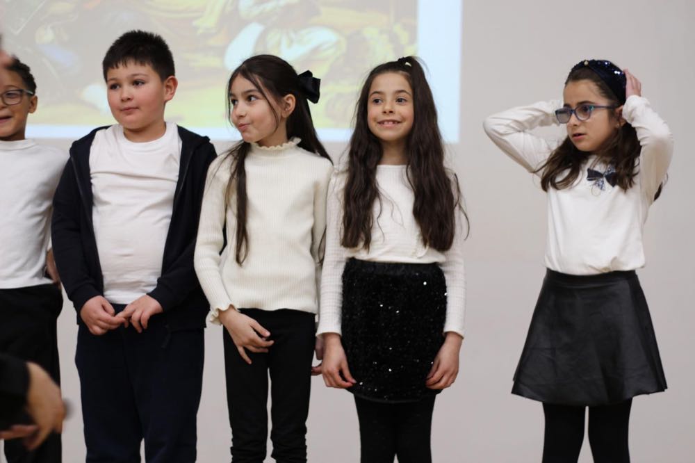 Children performing in our 25th of March play