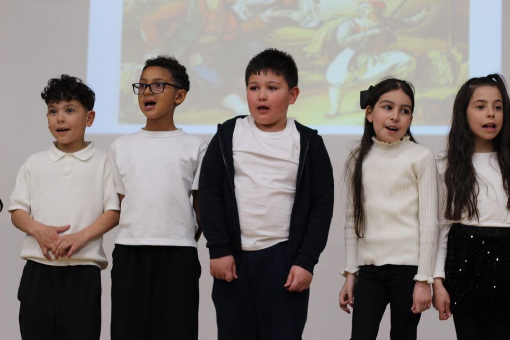 Children performing in our 25th of March play