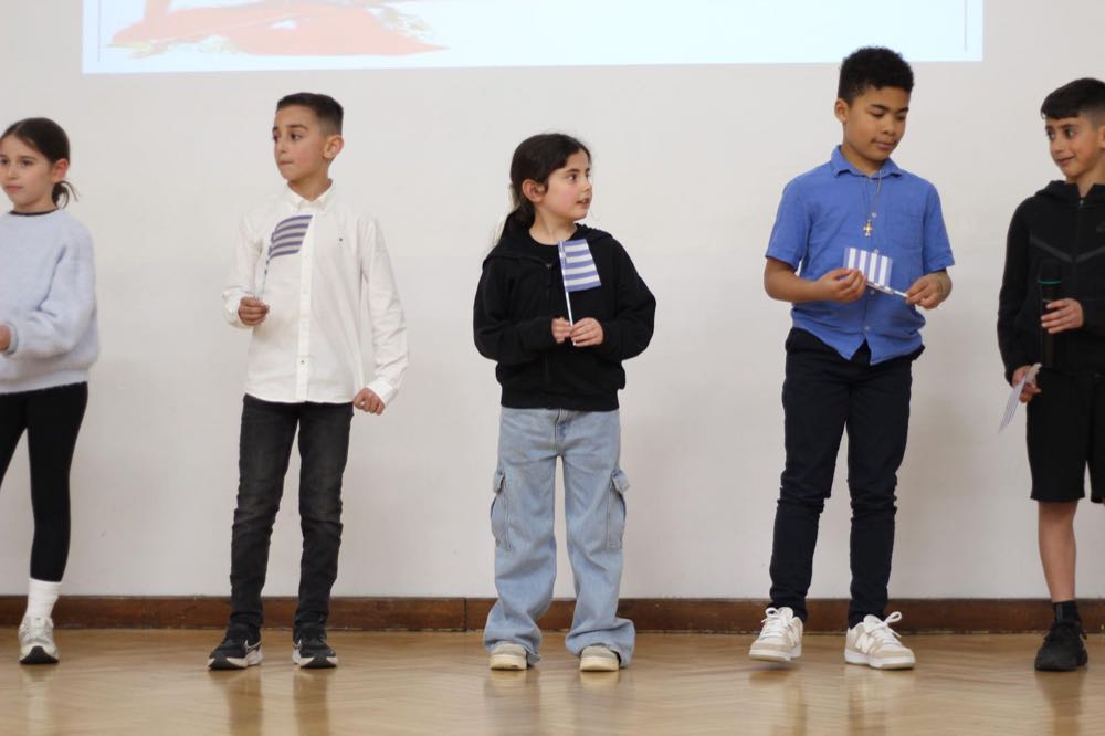 Children performing in our 25th of March play